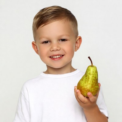 Boy holding green pear