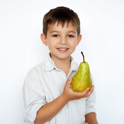Boy holding green pear