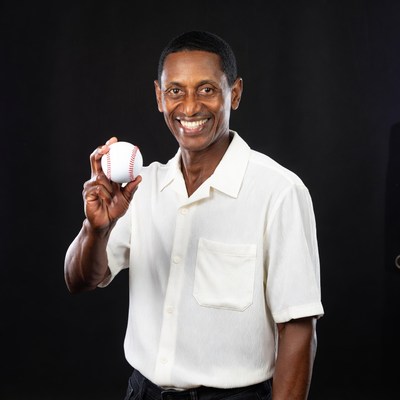 African-American man holding baseball