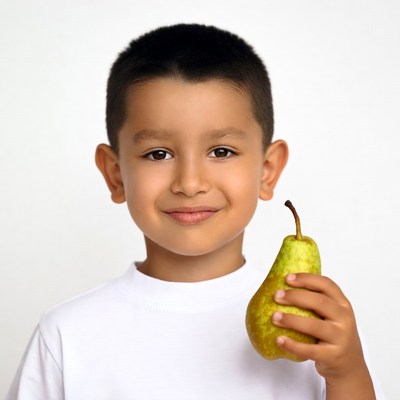 Boy holding green pear