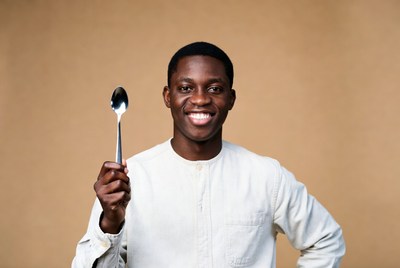 African-American man holding spoon