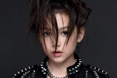 Asian girl in studded leather jacket