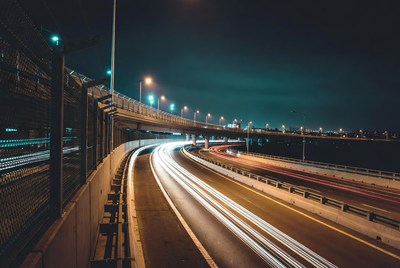 Night highway with light trails
