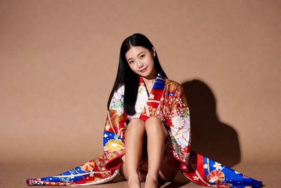Asian woman in colorful kimono sitting