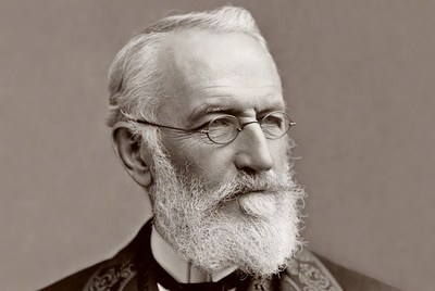 Elderly man with white beard and glasses