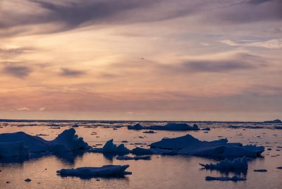 Icebergs in Arctic Sea at Sunset