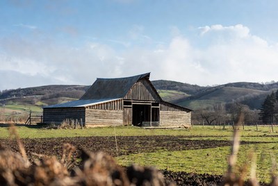 Rustic barn in rural field
