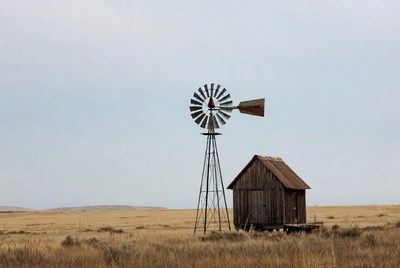 Rustic Windmill and Shed in Grassland