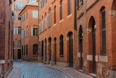Narrow Cobblestone Street in Brick Buildings