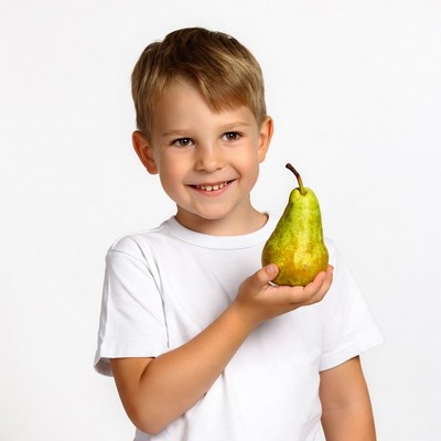 Boy holding green pear