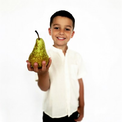 Boy holding green pear
