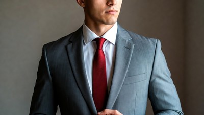 Man in gray suit red tie