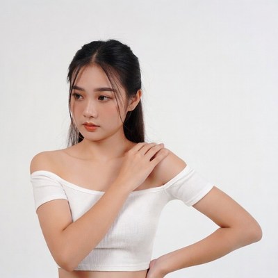 Asian woman in white off-shoulder top