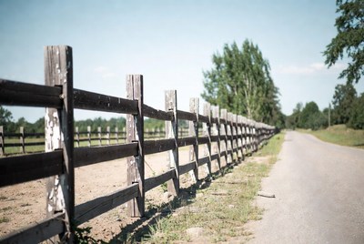 Wooden Fence Along Rural Road