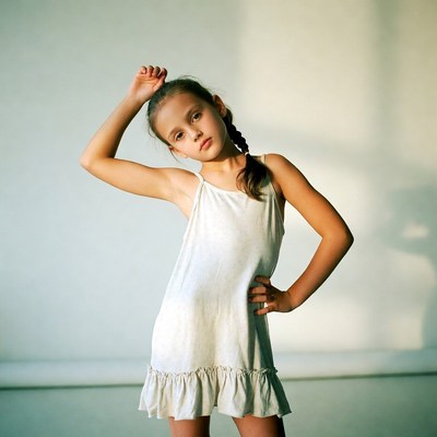 Girl posing in white sundress