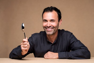 Man holding silver spoon
