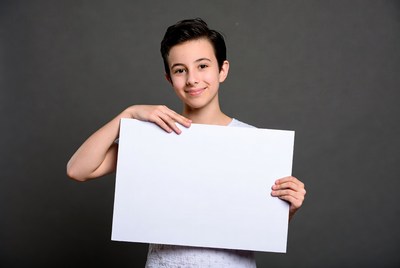 Boy holding blank sign
