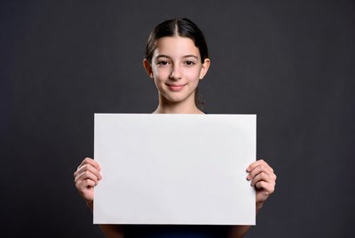 Girl holding blank white sign