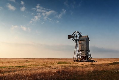 Rustic Windmill in Golden Grassland