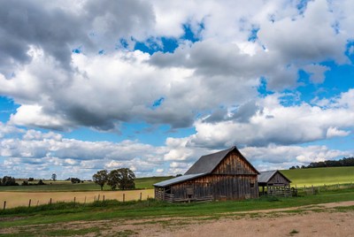 Old Wooden Barn in Rural Field