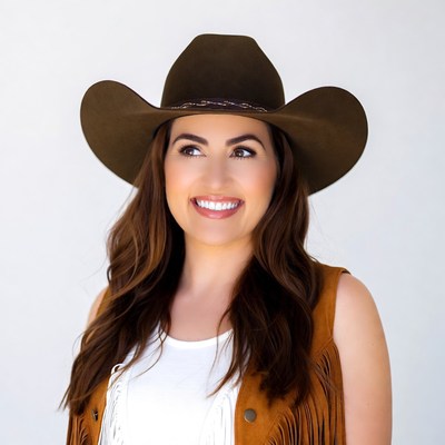 Smiling woman in brown cowboy hat