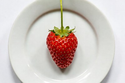 Fresh strawberry on white plate