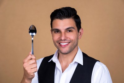Man holding silver spoon