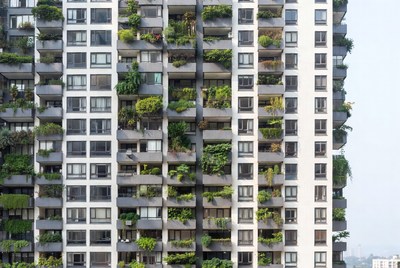 High-rise building with green balconies