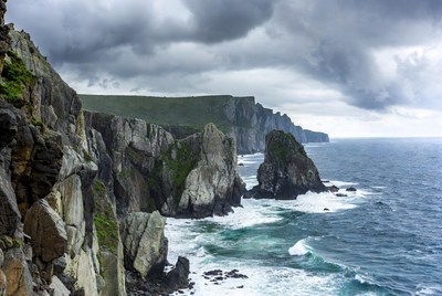 Dramatic Sea Cliffs with Stormy Clouds