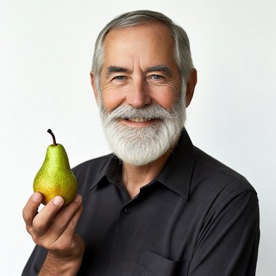 Elderly man holding green pear