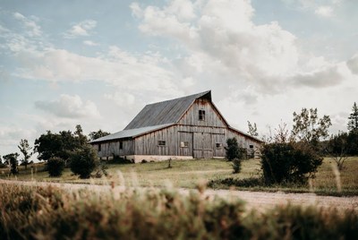 Rustic barn in grassy field