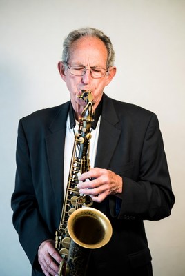 Elderly man playing saxophone