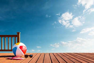 Beach ball and sunglasses on deck