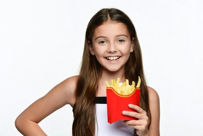 Girl holding french fries