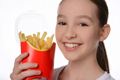 Girl holding french fries box