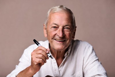 Elderly man holding black marker