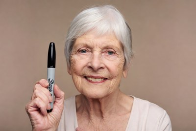 Elderly woman holding Sharpie marker