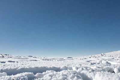 Snowy Landscape Under Blue Sky