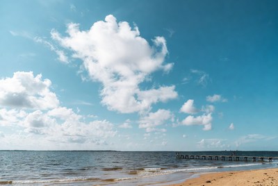 Pier extending over beach ocean