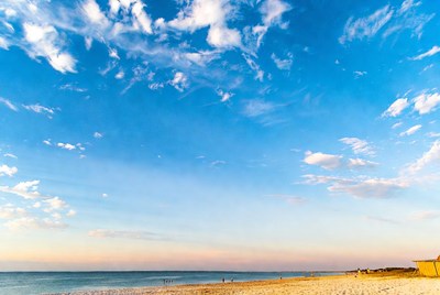 Ocean Beach with Distant People at Sunset