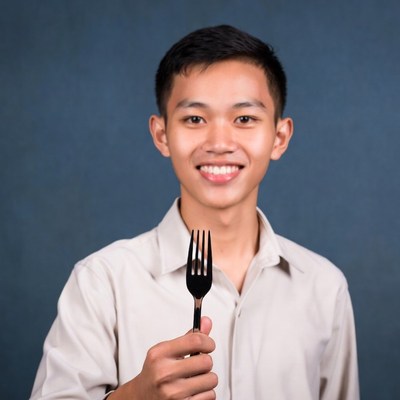 Asian boy holding fork