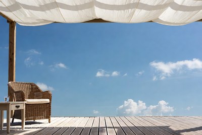 Wicker Chair Under White Canopy on Deck