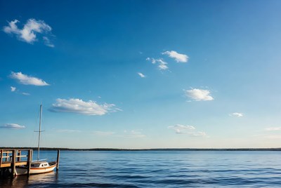 Sailboat docked at wooden pier