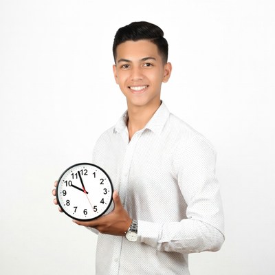 Young man holding clock