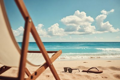 Beach chair with sunglasses and flip flops
