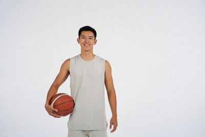 Asian man holding basketball