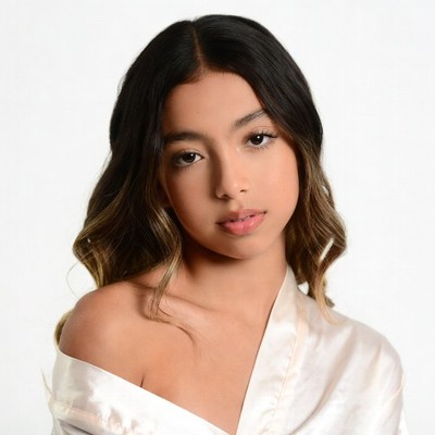 Young woman in off-shoulder silk top