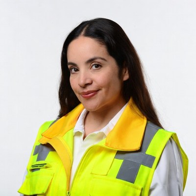 Latina woman in yellow safety vest
