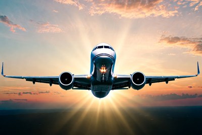 Airplane Flying into Sunset