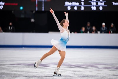 Woman figure skater performing on ice